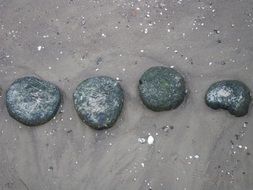 pebbles lie on the sand