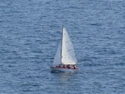 many people on a sailboat