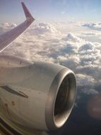 airplane engine above the clouds