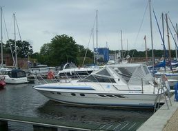 motor and sailing boats in harbor