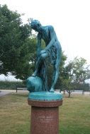 after the bath, Bronze statue of man drying himself in park, denmark, copenhagen