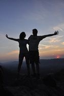 couple on the mountain at sunset