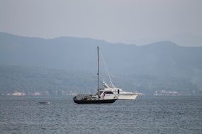 boats in the ocean view from the shore