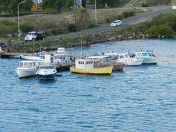 panoramic view of sailing boats on the ocean near the shore