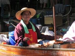 fruit vendor in a boat in Bangkok