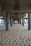 Wooden pier sand beach under holidays