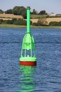 green buoy on the lake