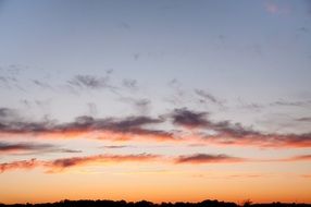 orange light clouds at sunset