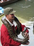 snake on a man's neck
