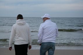 friends walk near the Baltic Sea