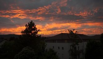 dark clouds in the sky with an orange glow