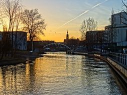 sunset over the river in the city bydgoszcz