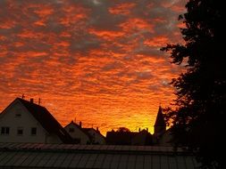 orange clouds over the city in the evening
