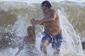 people swim in the big waves