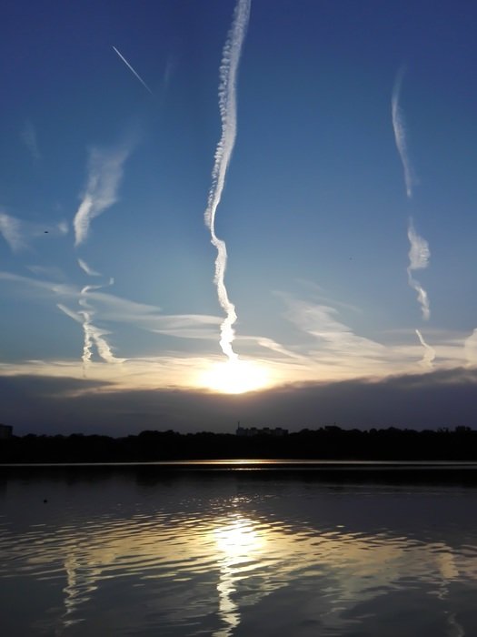 stripes in the sky over the lake