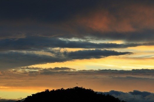 dark streaks of clouds in the sky
