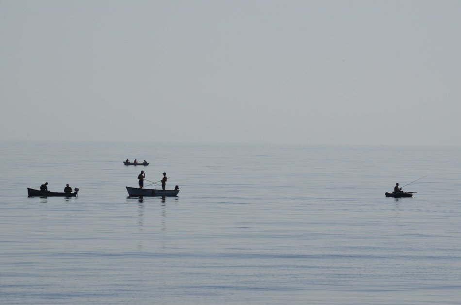 fishermen in boats in the morning