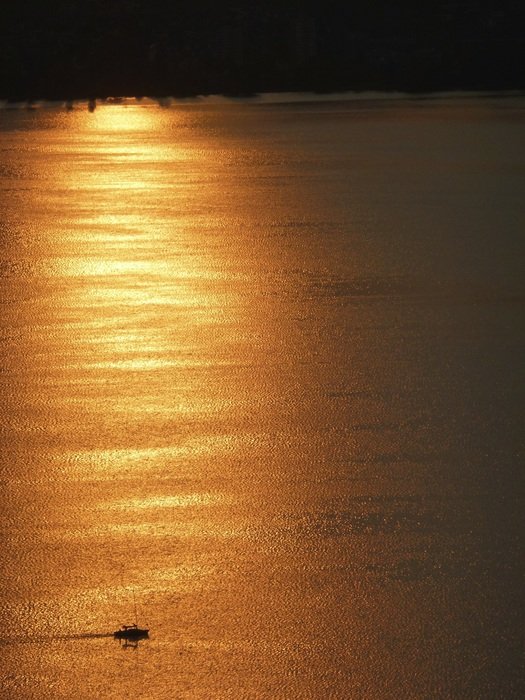 ship on the lake in the evening