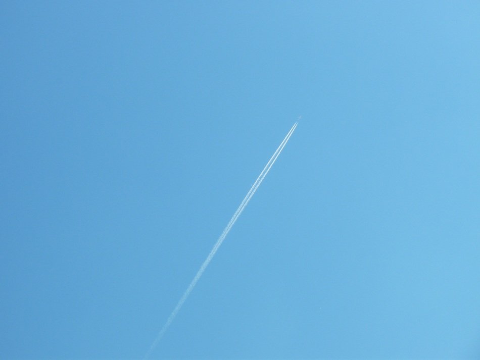 distant aircraft at blue sky