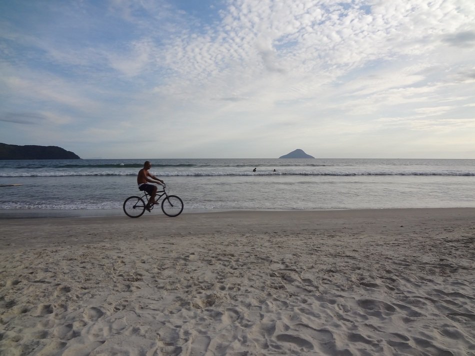 cyclist on the seashore