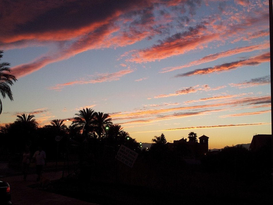 elongated pink clouds over the tropics