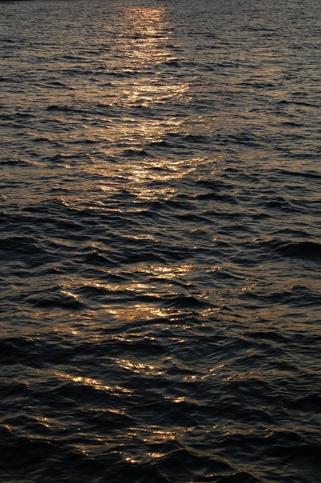 reflection of the sun in the dark water of the Baltic Sea