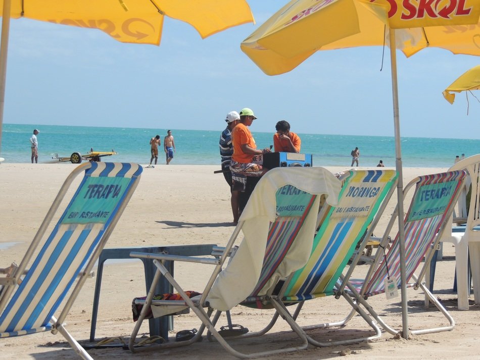 Colorful beach chairs and beach umbrellas on the sandy beach