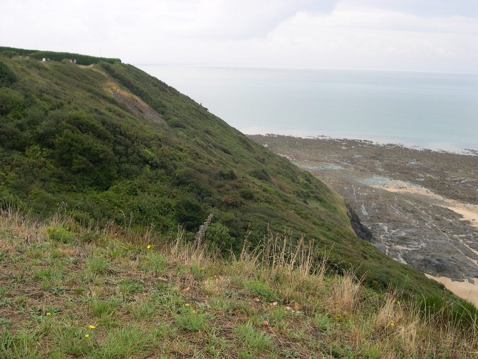 green hill by the sea