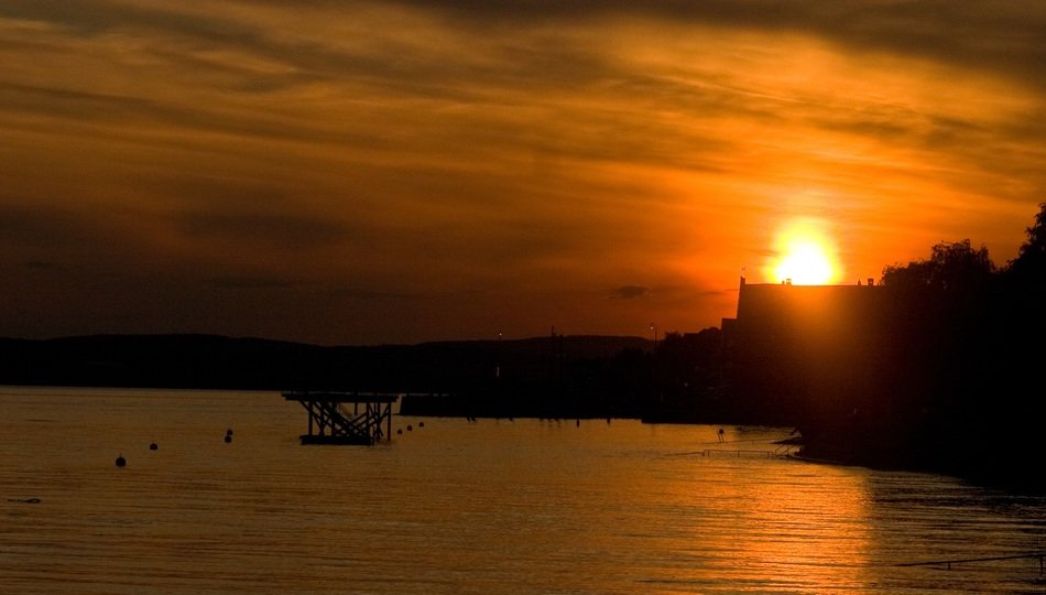 view of the sunset behind the building