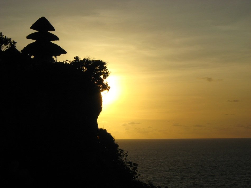 rocky coast of bali at sunset