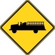 yellow road sign with fire truck