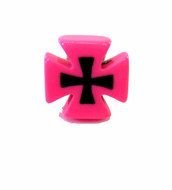 pink candle in the shape of a cross