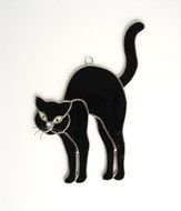 pendant in the shape of a black cat