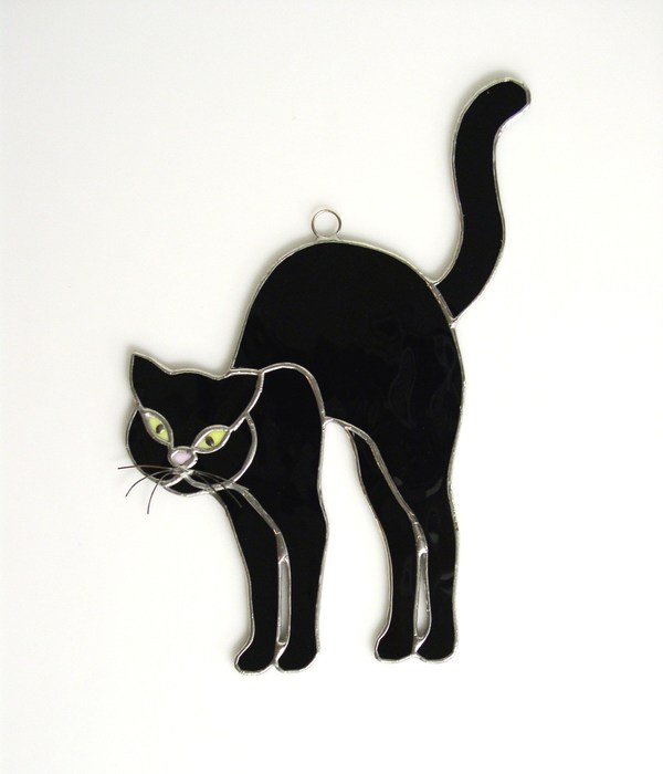 pendant in the shape of a black cat