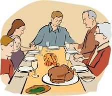 family at the table on Thanksgiving Day