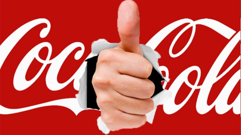 hand with thumb on Coca Cola logo