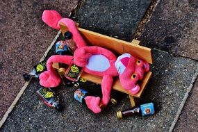 pink panther on a bench with bottles