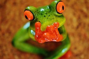 funny ceramic figure of a green frog