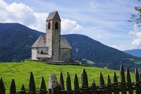 Church on green hill in Tyrol