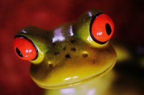 ceramic frog with big red eyes