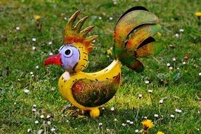 decorative element in the garden in the form of a cock