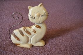 statuette of a tabby cat with a mustache