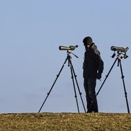 bird watching man with two Spotting Scopes, Ornithologist