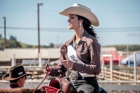 girl on a horse in a hat