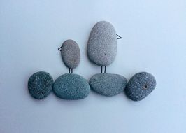 bird pattern laid out of pebbles