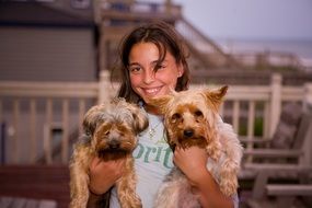 girl with two Yorkshire Terriers