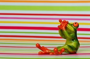 small figure of green scared frog