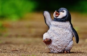 Cute penguin as a colorful figurine