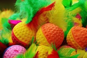 Foam balls with colorful feathers