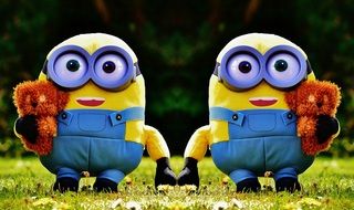 plush minions on green grass